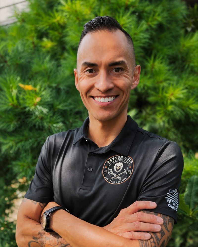 Sammy Bryson, owner of Bryson Built Services, in a branded polo with a Veteran Owned patch
